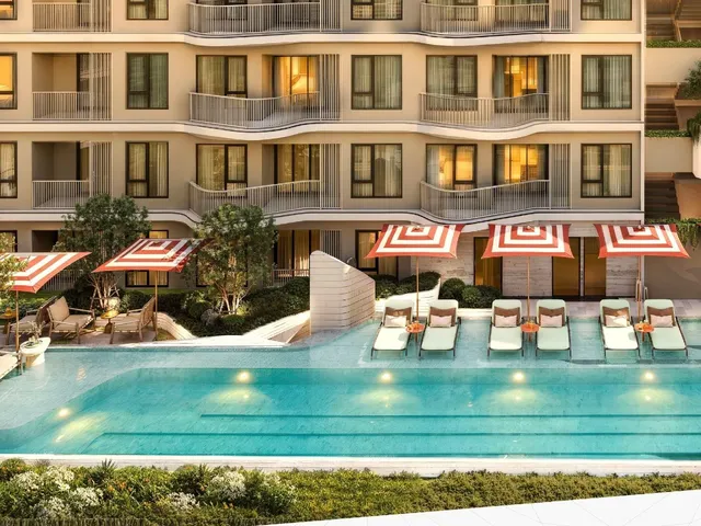 The Title Kuartz courtyard pool with loungers and umbrellas